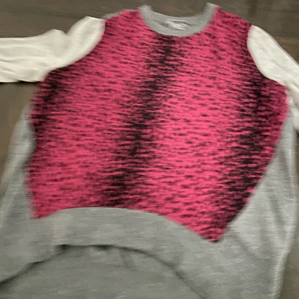 A fancy pink,gray, and black going out sweater.